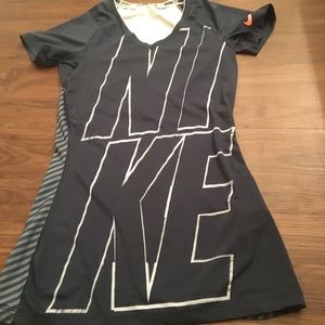 A Nike pro short sleeve blue top.